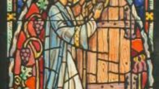 Stained glass window of a church picturing Letter to Laodicea